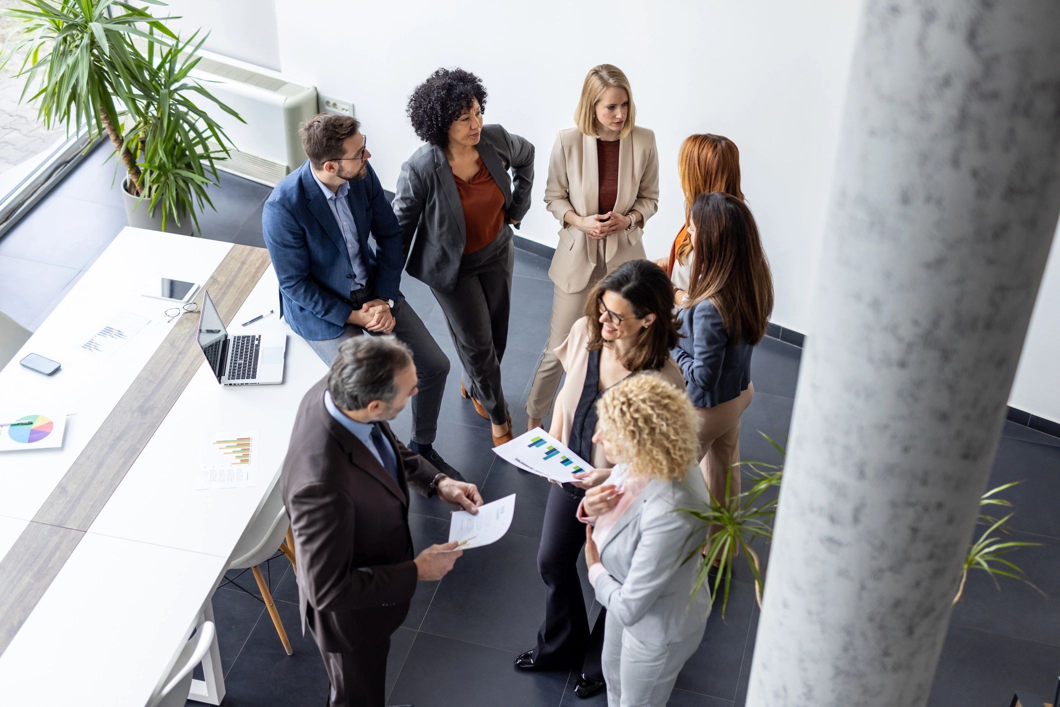 Team gathered around a table for financial planning discussion